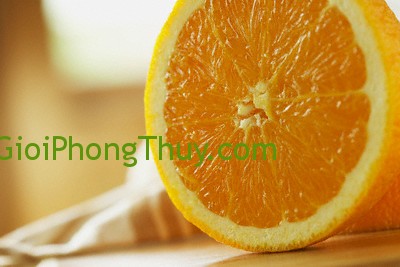 Orange cut in half --- Image by © Kate Kunz/Corbis