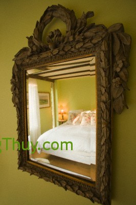 Reflection of bed in mirror --- Image by © Scott Barrow/Corbis